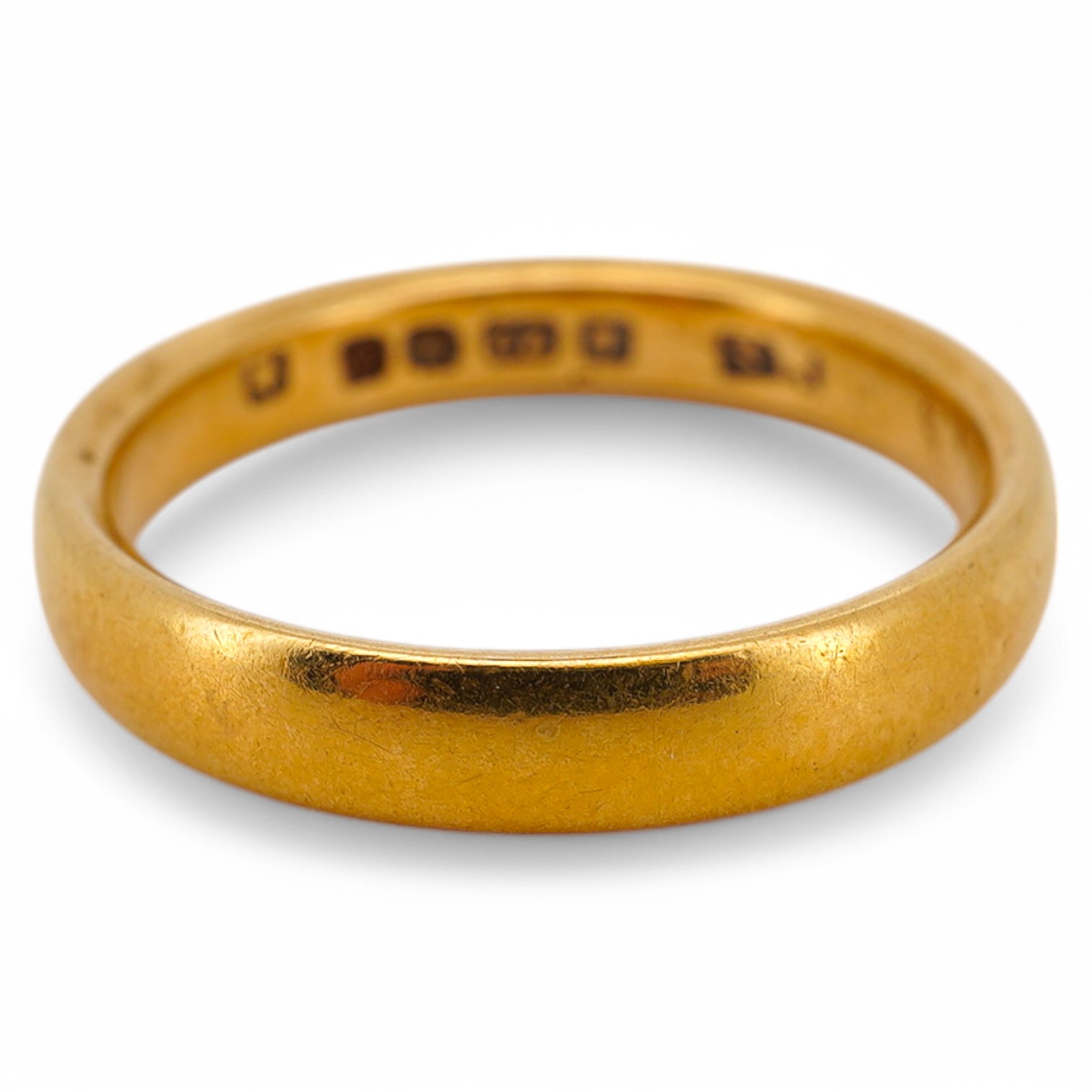 A George V 22ct gold wedding band, hallmarked for Birmingham, 1925, size N, 4.8 grams. Condition - fair to good